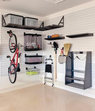 Storage Space Because the garage contains more than just cars, the house comes equipped with an extensive storage system from Gladiator GarageWorks. It includes a Modular GearBox, a GearWall, GearDrawers, shelves, and a workbench, among many other pieces. www.gladiatorgarageworks.com.
