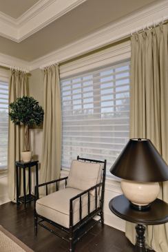 Blind Ambition With all the openings in the house, there is a need for sun protection as well as privacy. Hunter Douglas blinds and shutters provide both. NewStyle shutters in the great room, den, and second bedroom control light, while Silhouette Window Shadings in the master bedroom permit light but maintain privacy. www.hunterdouglas.com .