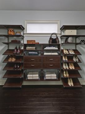 Case Clothes Schulte's freedomRail storage system is versatile enough for the kitchen pantry and coat closet, but fancy enough for the master closet. The setup, in a chocolate pear finish, has mirrored his-and-hers sections with Double Hang O-Boxes and is outfitted with shelves, baskets, and cabinets. www.freedomrail.com.