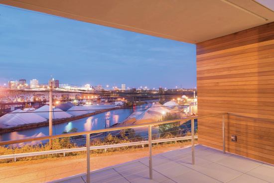 The back of the house looks out onto the Flats, and to views of the city skyline.
