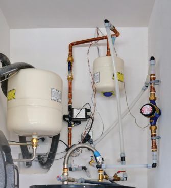 Water Saver A D'Mand recirculation system from Uponor further advances the house's water-conservation and energy-saving story. Installed with a user-activated button and motion sensors, the system's pump recirculates cold water so hot water reaches the fixture in seconds. www.uponor-usa.com.