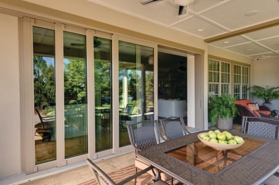 Wide Openings Providing visual and physical access to the lanai and backyard grill is an impressive 16-foot-wide installation of WinDoor's 8000 series sliding glass panels. Each panel has a depth of 1 3/4 inches with 4 5/8-inch stiles and rails. Specified with low-E glass, the doors glide on a stainless steel system that stacks the 10-foot-tall panels to the side. www.windoorinc.com.