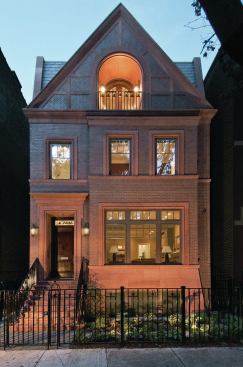 The Chicago street this infill home sits on hadn't seen new construction in a century. It takes a close look to see that the house was completed barely a year ago.