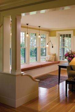 On the south side of the living room, a window seat is the perfect place to curl up and read.