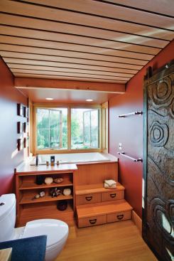 The 18-inch-deep bathtub is a drop-in standard model from Kohler that fits in a 5-foot alcove. The bath area is built into a window bay that cantilivers out into the garden. Stepped Douglas fir cabinetry in the Asian tansu style makes the most of a small room, adding storage space as well as visual interest. 


Idea Garden, Healdsburg, Calif. Architect: Arkin Tilt Architects, Berkeley, Calif.; Builder: Earthtone Construction, Sebastopol, Calif.; Cabinet Maker: Higgins Cabinetry, Duncans Mills, Calif.