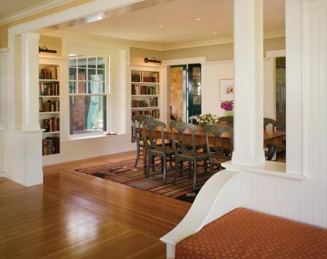 Decorative posts frame the dining room, which flows into the kitchen, making for an open plan that’s clearly defined. 