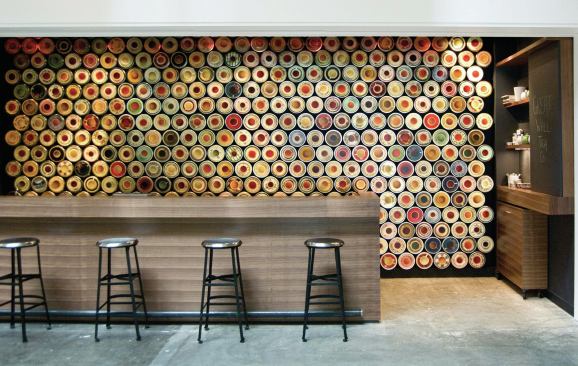 A staggered array of tea containers cling to a magnetized wall, creating dramatic and beautiful storage. The practical idea is a simple one, and it translates well to home kitchens—works great for spices. 


Great Wall Tea Shop, Vancouver, British Columbia. Architect: Marianne Amodio, Vancouver; General Contractor: Woodworks Custom Developments, North Vancouver; Millwork: Fullbore Design, Vancouver