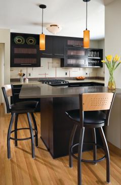 Modern black and white kitchen showing bar height counter and bar stools