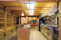 Bell speced energy-efficient fluorescent lights throughout his house, but he wanted a softer glow. So he customdesigned a kitchen fixture that diffuses the light with frostedglass panels held in place by a slim steel grid.