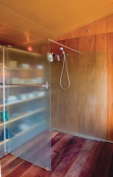 Stainless steel screws fasten the bath’s plywood panels to an earthquake-resistant shear wall. The screws’ tight symmetrical pattern not only meets required construction techniques, it also becomes a nifty design detail.