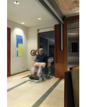 The kitchen also needed to be usable for the clients' son, who uses a wheelchair. He enters the kitchen using a ramp that's manually controlled and simple to operate.