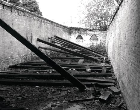 The Millers reclaimed the pine from the original structure's roof and kept the three existing brick walls.