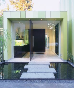 Guests enter as if crossing a moat.