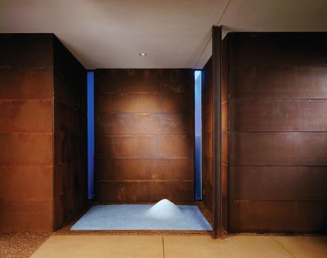 Another indentation holds a playful surprise—a ground-glass Zen garden that local wildlife rearrange at night.