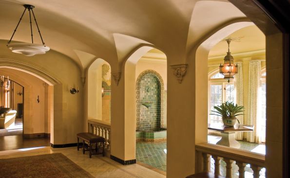 Sunlight flows freely throughout the newly open rooms. Fine details—carved plaster railings and precision woodwork—abound.