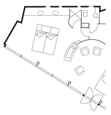 The architects enclosed the toilet in a separate room between the master suite and the home's main entry, making it easily accessible to residents and guests.