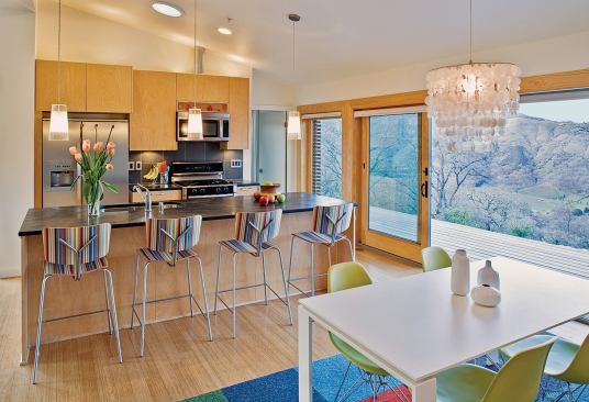 At another Glidehouse in Ukiah, Calif., the kitchen island doubles as a casual dining spot. "We're in the middle of a cultural shift," she says of this move toward multipurpose features. "We want homes that aren't necessarily bigger but do more, like an i