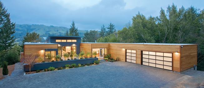 A sunset Breezehouse in San Geronimo, Calif., welcomes sunlight and mountain views into its central dining and living room and its cobalt-blue kitchen.