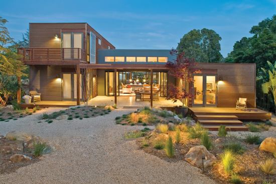 The rusted, corrugated metal cladding on a custom Sunset Breezehouse picks up the red hue of the tiled roofs that populate its Santa Barbara, Calif., surroundings.
