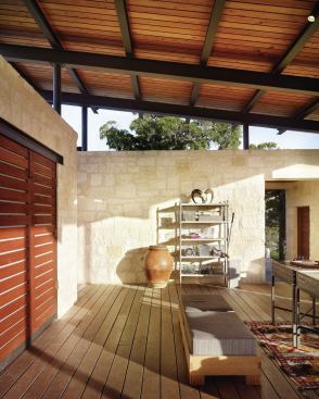 Western red cedar slats close off the kitchen and media center.