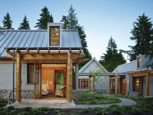 Arbors shade numerous patios and entranceways, which connect via walkways through low-maintenance plantings. The site includes a raingarden stormwater catchment system and a high-efficiency irrigation system.