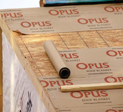 MAGNUM OPUS: Opus Roof Blanket is touted as being superior to both felt paper and plastic sheeting underlayment. Its composition gives it a slip-resistant surface, and its blanket surface makes it easy for roofers to snap a chalk line. Lightweight and easy to work with, the product stays cool in summer and works in freezing temperatures.  Propex Operating Co. 404-276-6394. www.opusroofblanket.com.
