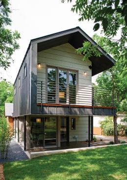 A deep roof overhang on the addition continues down the wall to provide protection from southern exposure for the master suite balcony.
