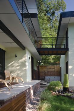 The oversized balcony provides a bridge to the detached garage and art studio.