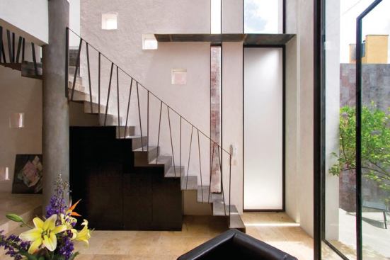 A folded plate steel stair connects levels of the third CASA building.