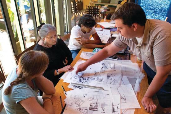 Cathi House presides over a design crit session with students.

