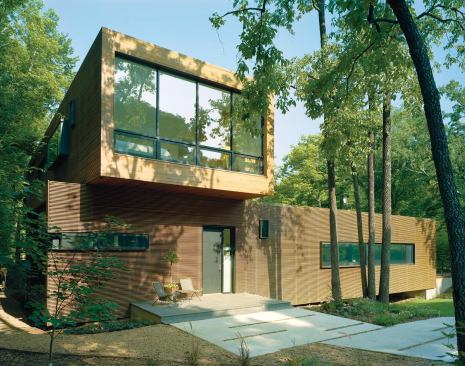 Exterior louvers are made of dense, fire-rated Brazilian redwood. They're stacked, as one might find them in a lumberyard, to create 50 percent transparency.