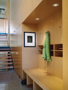 A landing between the ground level and the first floor doubles as the house's main entry hall.

