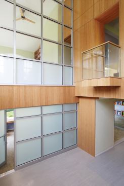 Subtract to Add Light

This suburban Manhattan basement design called for subtracting space from the main floor to bring light and air into the first-floor space. Designer Michael Eisner used double-height bamboo walls and a storefront glazing system in the basement's atrium entry.