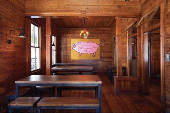 The architect played up the tint of the original pine with amber lighting, creating “golden boxes” of the former dining and living room. The custom lights were made by local artist Jake Harper.