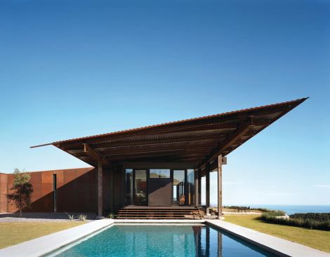 The roof shields the house from the sun and tips up toward the view.


