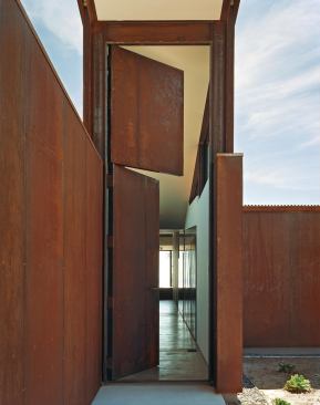 The Dutch door and long hallway funnel in cooling offshore breezes.


