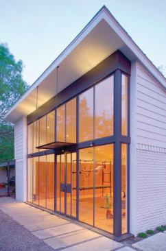 Even with the custom fabricated steel window wall and other metal work, Susan Appleton kept the cost low by reusing most of the existing garage. 

