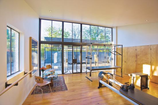 The project's roof soars to 11 feet at the high end, bringing natural light to the studio.

