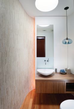 Varied finishes in the powder room add texture.