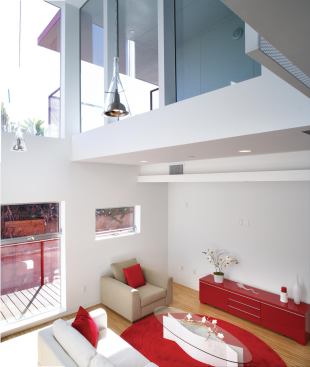 Double-height living rooms allow ample views onto the landscaped park, which is maintained using city funds.

