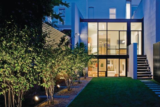 The sleek addition vastly improves the project's connection with its rear yard.

