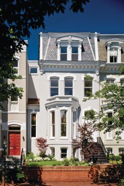 The home's stately, Second Empire–style street elevation is barely changed.
