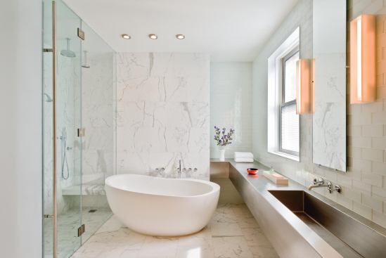 A modern, marble-and-steel master bath.

