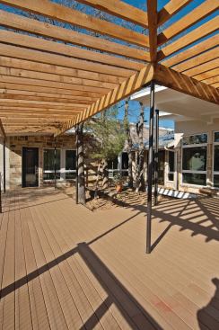DECKING Engineered decking from Trex is manufactured from recycled plastics and wood fibers to achieve a durable plank that does not require additional treatments to protect against the elements. The company’s Accents series features a finished wood-grain on one side of the plank and a smooth finish on the other, enabling design flexibility; available profiles include straight and groove-edged, 1-inch-thick planks and nominal 2x6 planks. The saddle color specified is engineered to weather only slightly from its original hue. 800.289.8739. 
www.trex.com.