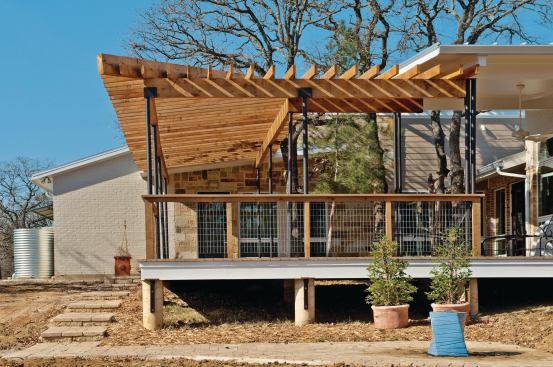 The home's back deck encircles an existing tree on the property, preserving the landscape while providing additional shade.