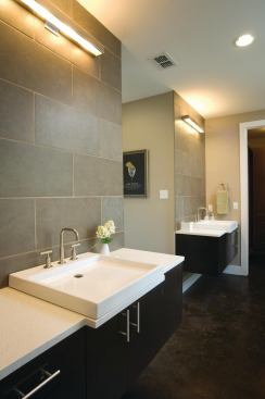 BATH FIXTURES

Kohler supplied its standalone Escale bathtub; Purist sinks, faucets, and shower fittings; and Reve toilet to the master bathroom. The dual-flush (1.6-gpf/0.9-gpf), elongated toilet is WaterSense-labeled to reduce water use, as is the Purist wide-spread lav faucet, which includes a ceramic-disc valve for increased durability. The shower control features the company’s Rite Temp pressure-balancing valve and high-temperature limit sensor to help reduce water use. 800.456.4537. www.kohler.com.