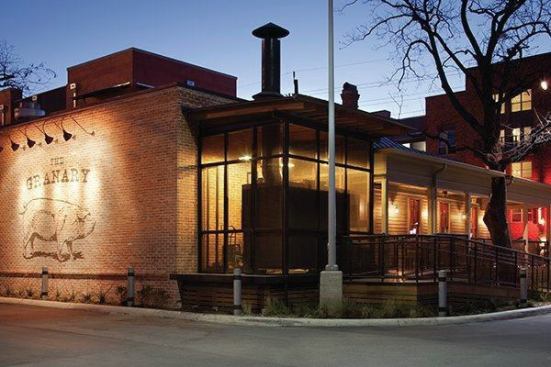The kitchen addition’s steel structure and concrete floor were required to meet the fire code. A local artist painted the restaurant logo on the reclaimed brick exterior.