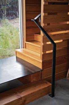 A metal plinth forms a small staircase landing.