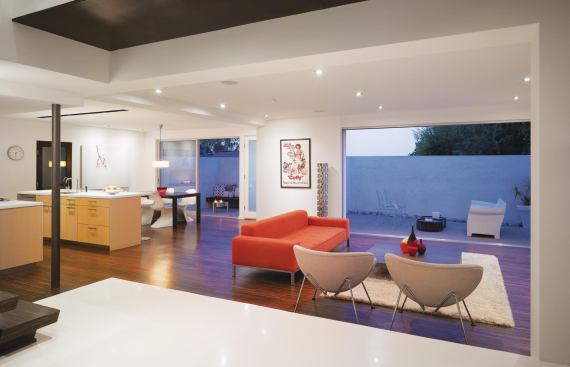 The new interior features rift-cut white oak, glass mosaics, limestone, recycled oak concrete, and epoxy resin throughout. 

