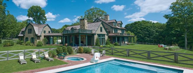 Like many Kais Custom Builders projects, this new Fairfield, Conn., residence involved more than just a house. The 6-acre site also holds a separate garage structure, a pool, and a horse barn. Architect: Mark P. Finlay Architects, Southport, Conn.